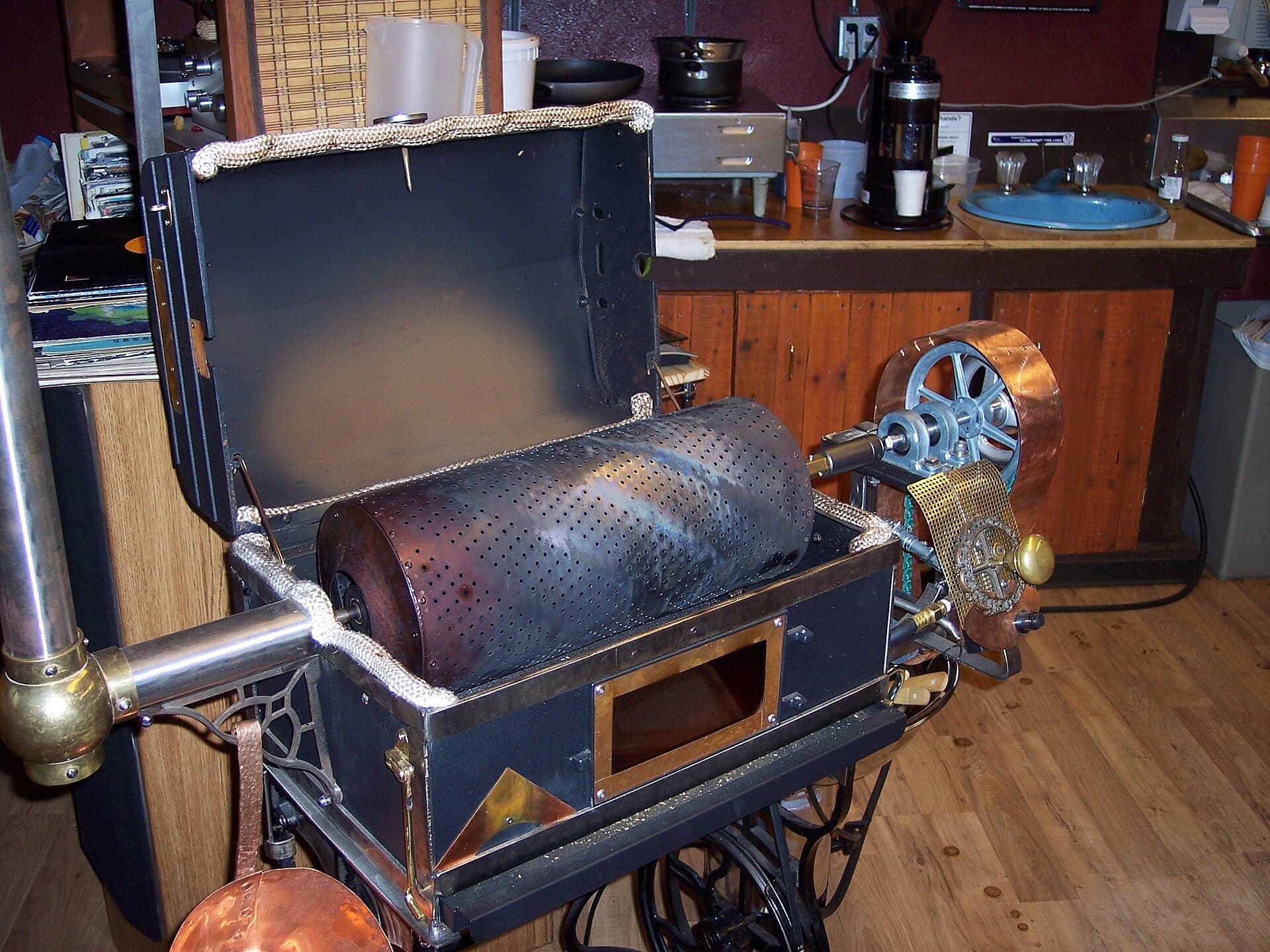 A drum coffee roaster at work